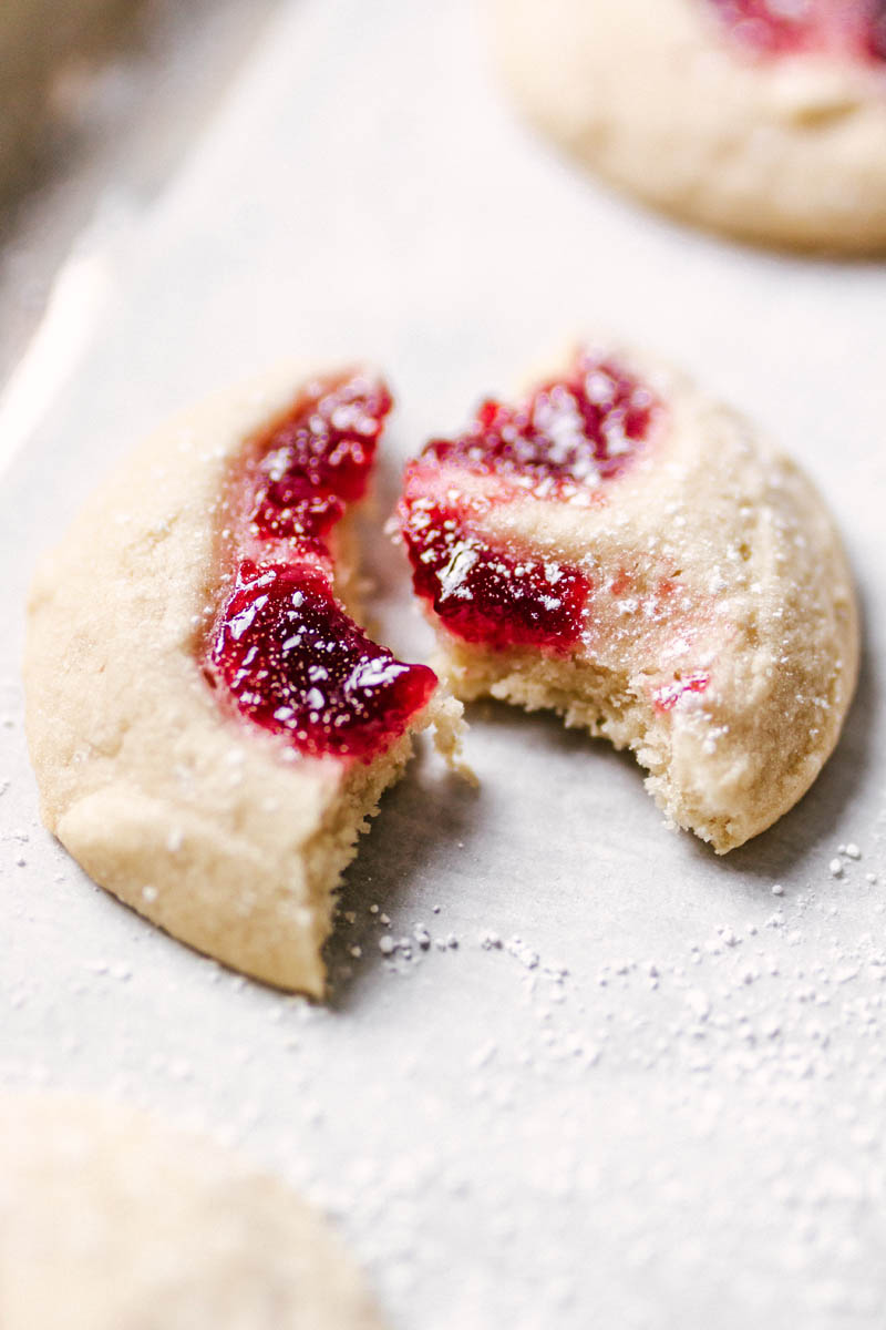 cookie pulled apart and bitten into, showing the chewy soft texture