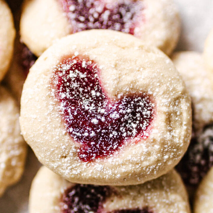 heart thumbprint cookies stacked on top of each other