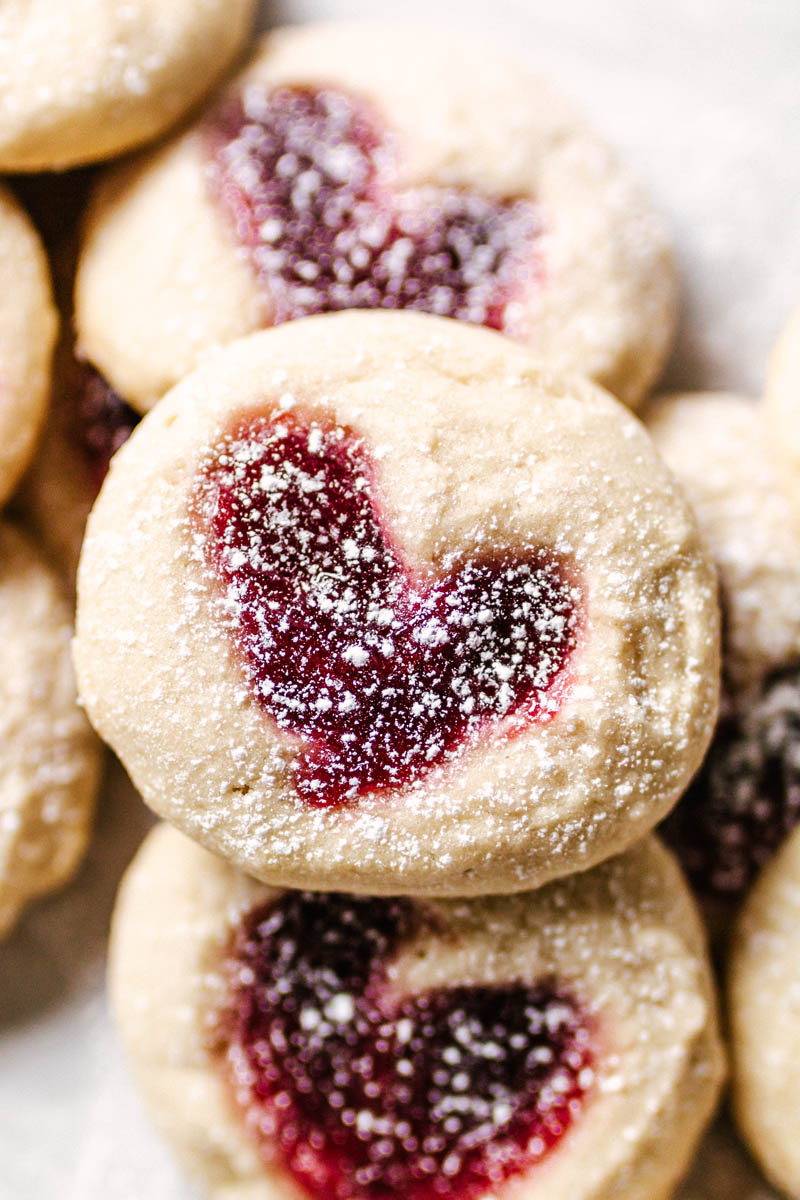 heart thumbprint cookies stacked on top of each other