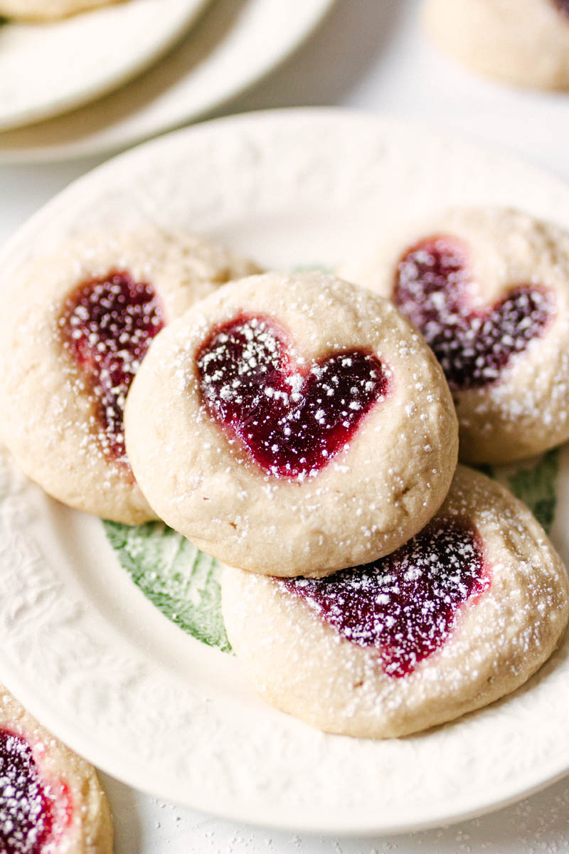 heart thumbprint cookies stacked on a plate