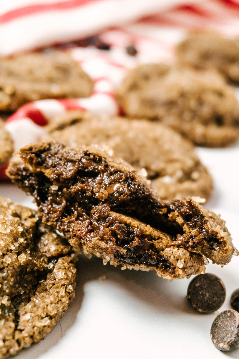 chewy dark chocolate cherry cookie opened up to show the moist and chewy texture