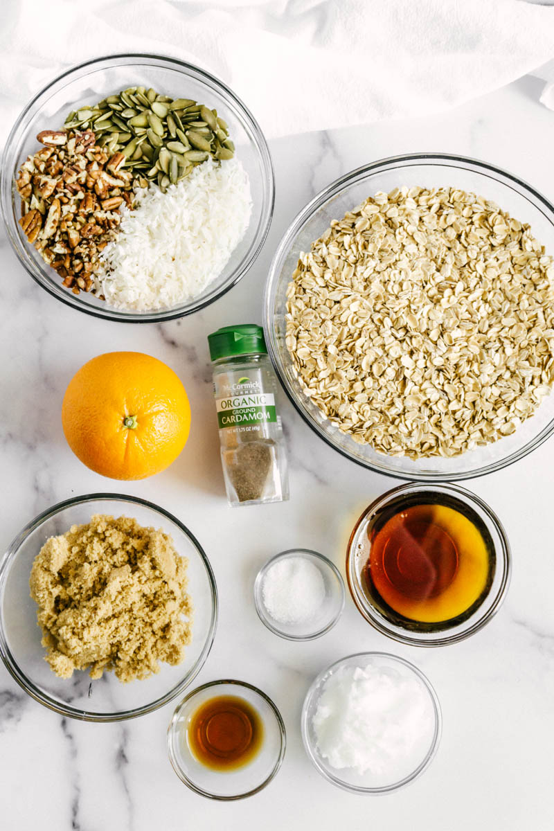 ingredients for the granola spread out on a table from a birds eye view