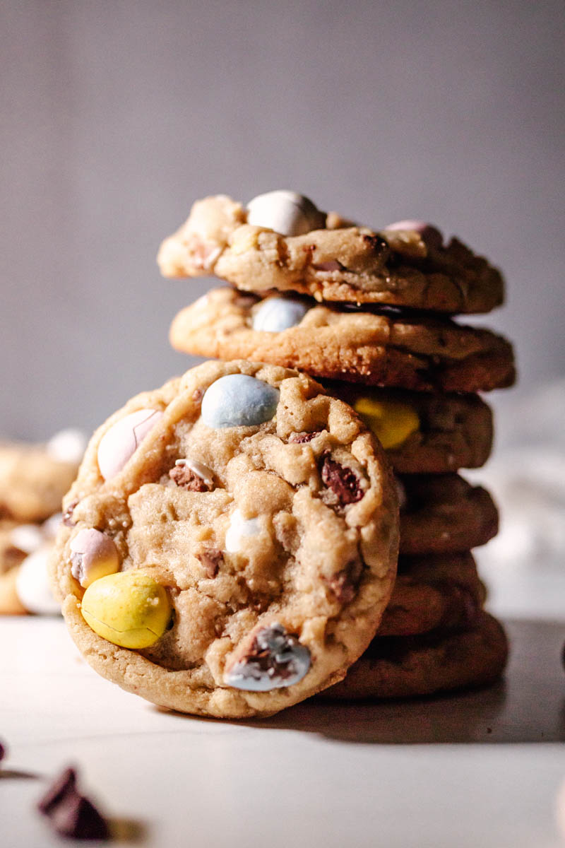 mini egg cookies stacked on top of each other