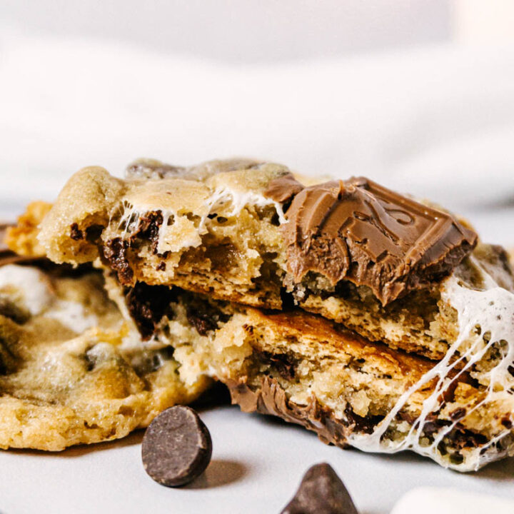 up close shot of a smores cookie, with a gooey marshmallow stretching